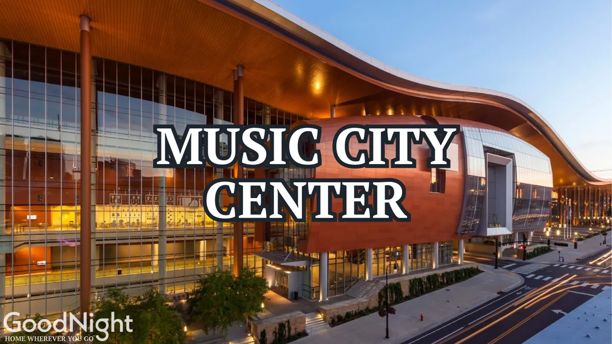 This exterior image captures the dramatic architectural design of Music City Center, featuring its signature large glass windows and unique roof structure. The surrounding urban landscape hints at the convention and business energy of downtown Nashville.
