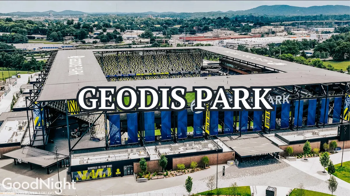 An exterior shot of GEODIS PARK, Nashville’s modern stadium, with prominent signage and surrounding greenery. The atmosphere is lively, with fan gathering areas hinting at group experiences and entertainment beyond golf.